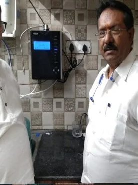 Man showcasing the convenience of using Chanson Quality Water Purifier