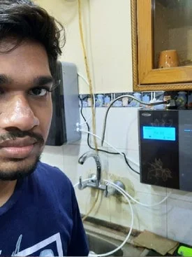 Man engaging with the user-friendly Chanson Water Purifier
