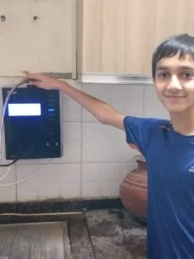 kid engaging with the user-friendly Chanson Water Purifier