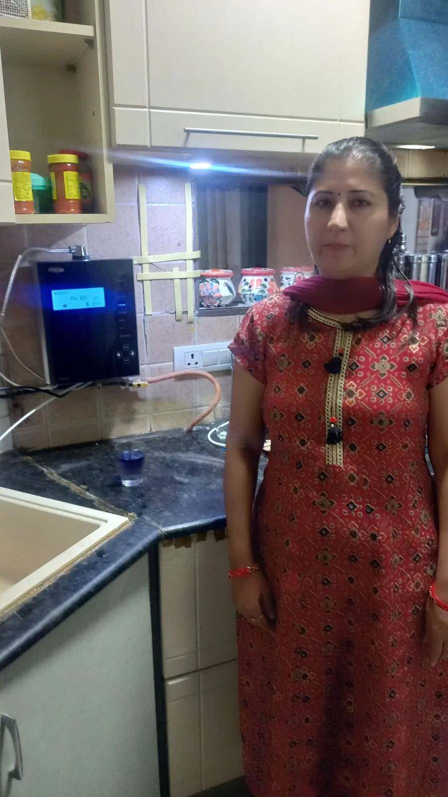 women customer utilizing Chanson Quality Water Purifier for daily hydration
