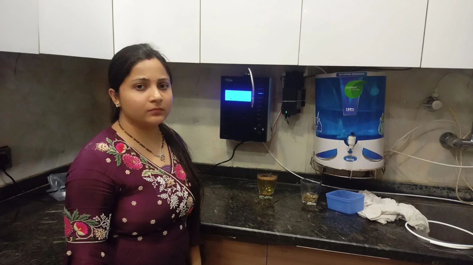 Satisfied female customer with her Chanson Quality Water Purifier